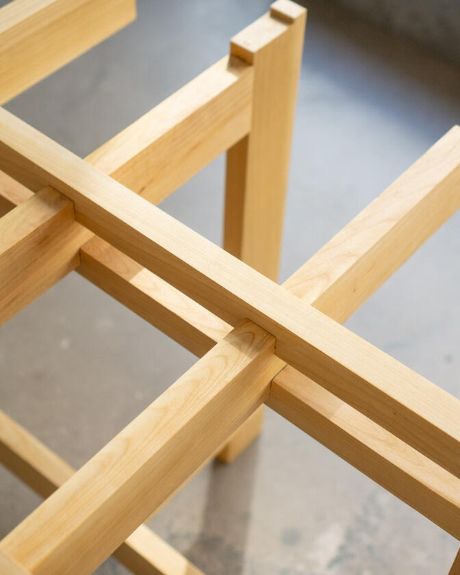 a desk made of solid european cherry wood with a surface of handbrushed aluminium designed by Liam Barwick