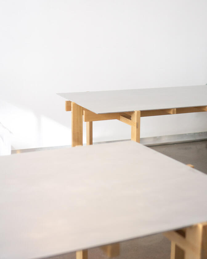 a desk made of solid european cherry wood with a surface of handbrushed aluminium designed by Liam Barwick