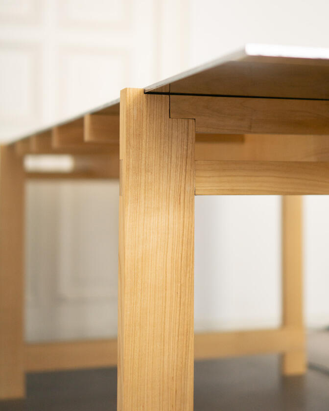 a desk made of solid european cherry wood with a surface of handbrushed aluminium designed by Liam Barwick