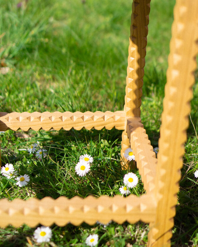 A stool made of solid european cherry wood and a handwoven seat of braided seagrass designed and made by Liam Barwick