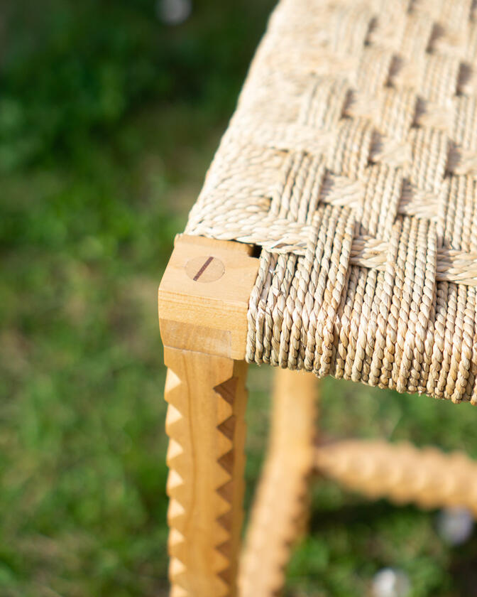 A stool made of solid european cherry wood and a handwoven seat of braided seagrass designed and made by Liam Barwick