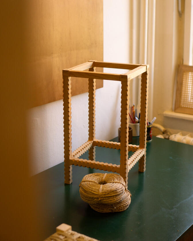 A stool made of solid european cherry wood and a handwoven seat of braided seagrass designed and made by Liam Barwick