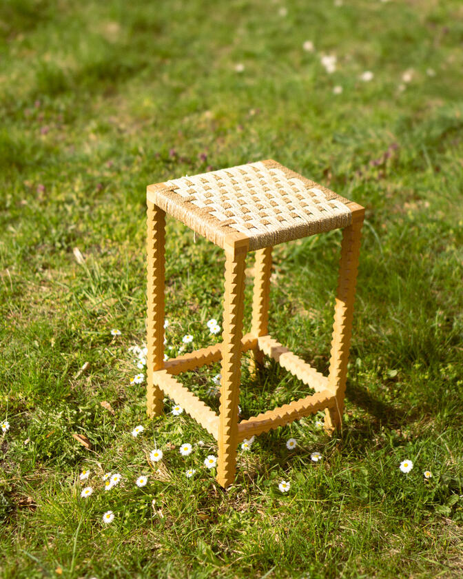 A stool made of solid european cherry wood and a handwoven seat of braided seagrass designed and made by Liam Barwick