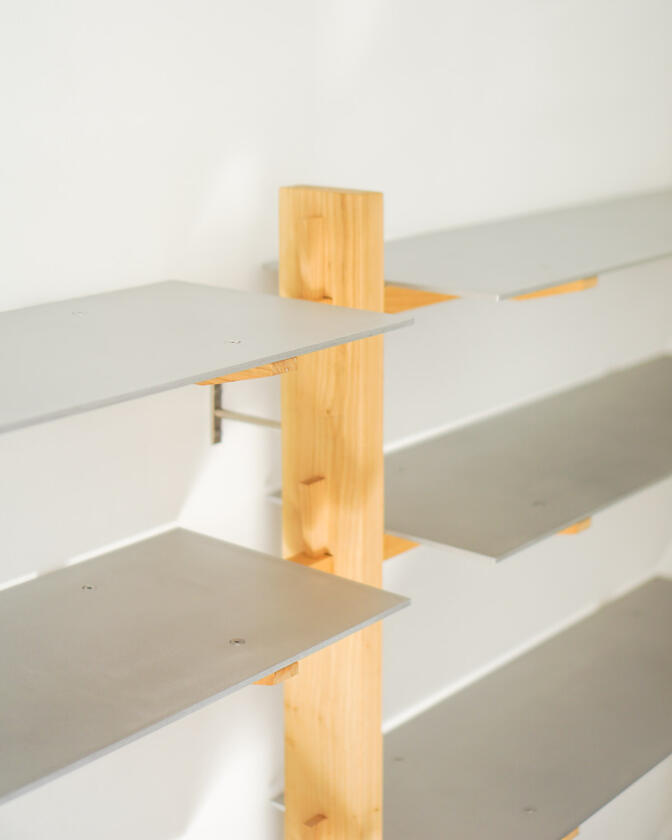 Wall shelf constructed of solid european cherry and hand brushed aluminium shelving designed and made by Liam Barwick