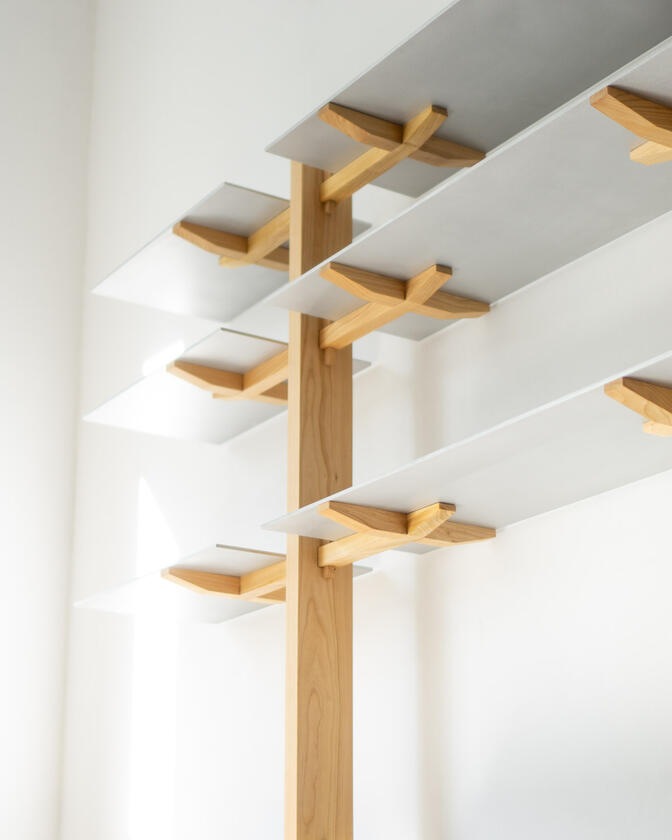 Wall shelf constructed of solid european cherry and hand brushed aluminium shelving designed and made by Liam Barwick