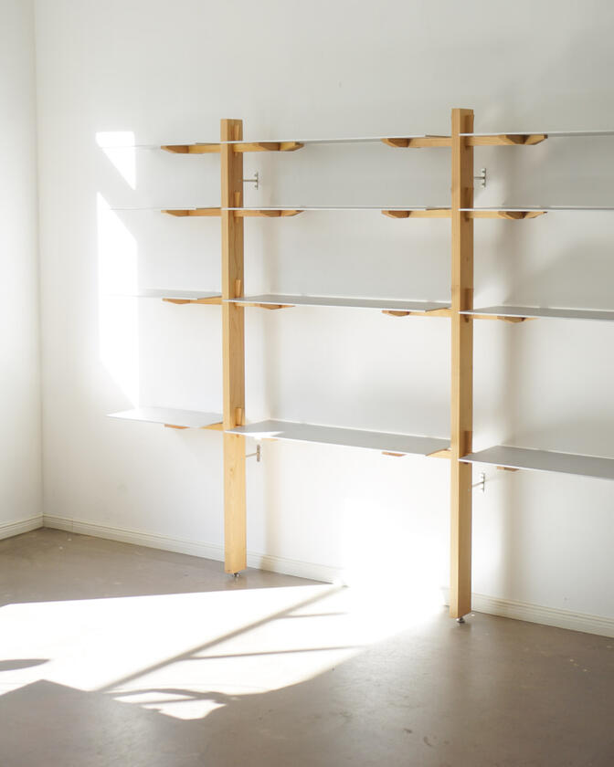 Wall shelf constructed of solid european cherry and hand brushed aluminium shelving designed and made by Liam Barwick