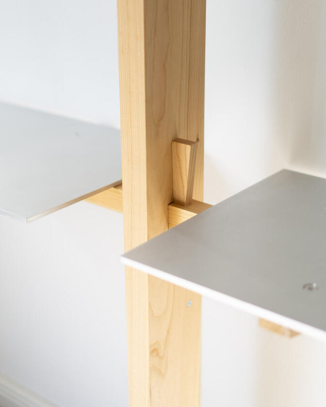 Wall shelf constructed of solid european cherry and hand brushed aluminium shelving designed and made by Liam Barwick