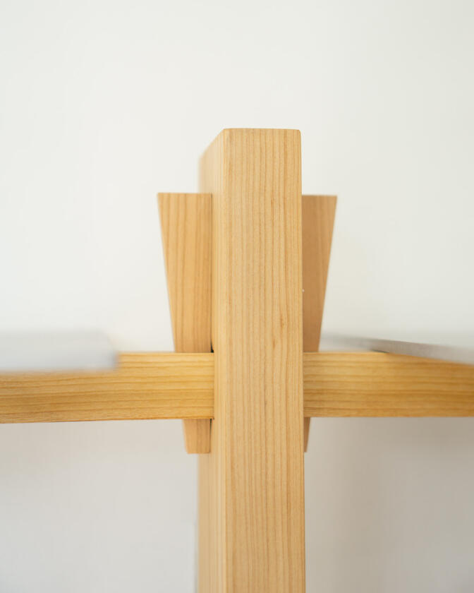 Wall shelf constructed of solid european cherry and hand brushed aluminium shelving designed and made by Liam Barwick