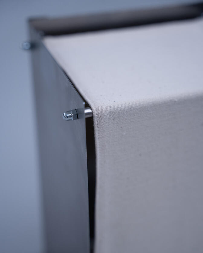 A table lamp constructed of a raw steel exterior and a soft organic cotton canvas diffuser. Designed and constructed by Liam Barwick