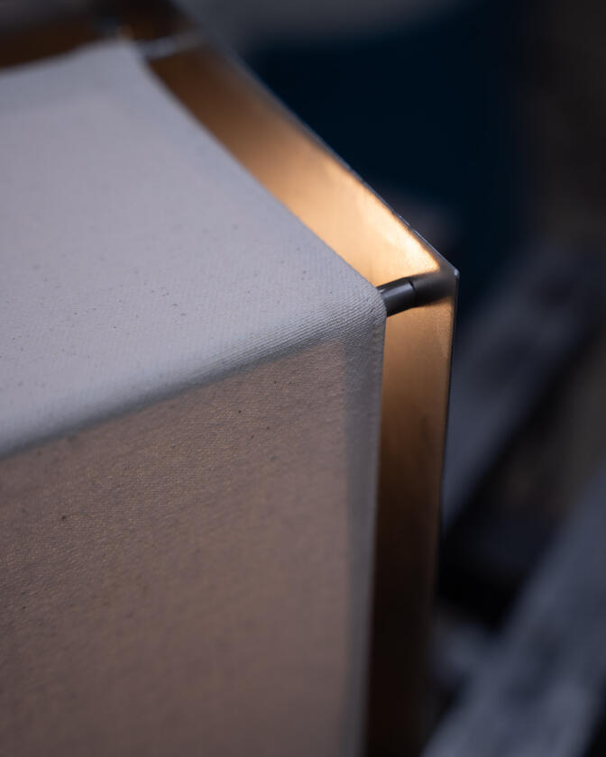 A table lamp constructed of a raw steel exterior and a soft organic cotton canvas diffuser. Designed and constructed by Liam Barwick