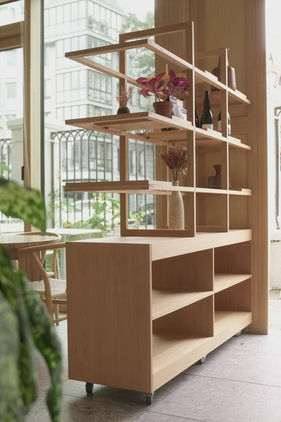 A shelving unit and room divider made of beech wood designer and built by Liam Barwick