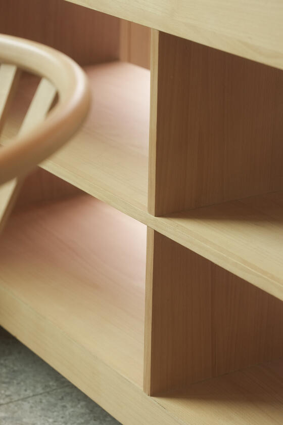 A shelving unit and room divider made of beech wood designer and built by Liam Barwick