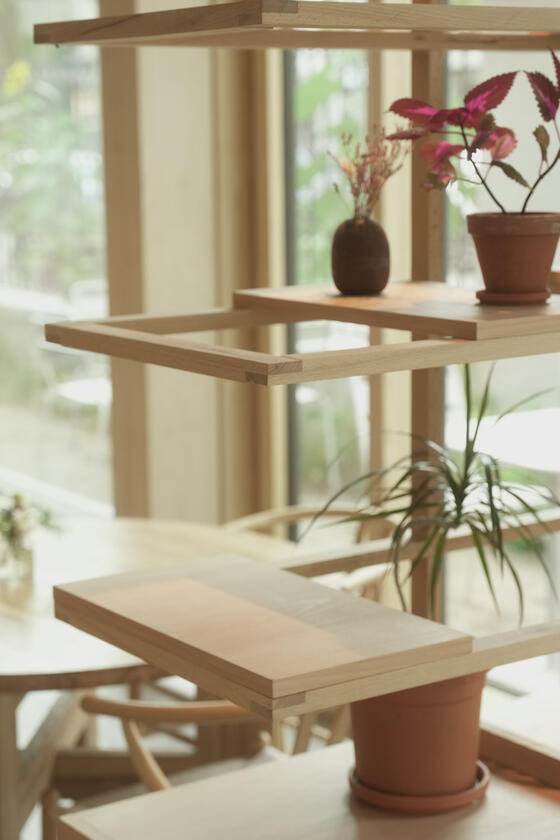 A shelving unit and room divider made of beech wood designer and built by Liam Barwick