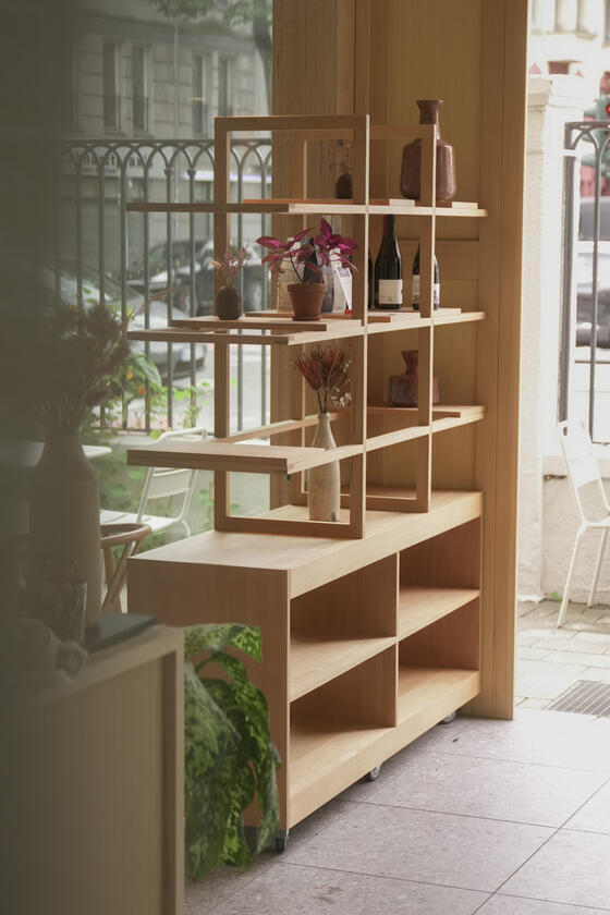 A shelving unit and room divider made of beech wood designer and built by Liam Barwick