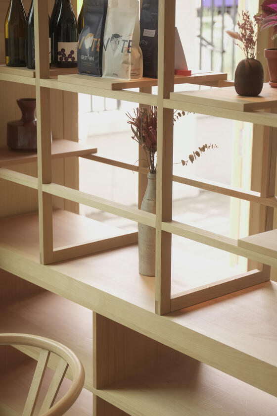 A shelving unit and room divider made of beech wood designer and built by Liam Barwick
