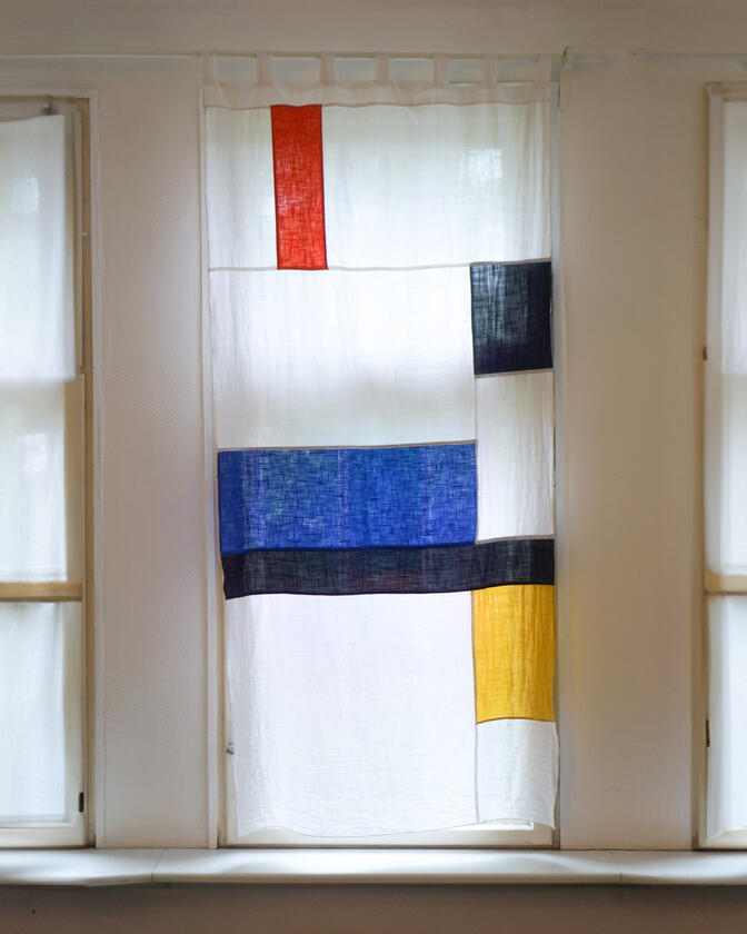 A set of colourful linen curtains in the traditional korean patchwork style of pojagi, designed and made by Liam Barwick